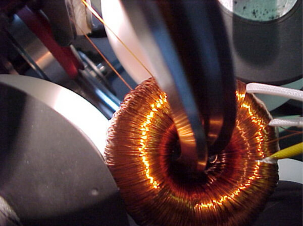 Toroidal transformer being wound